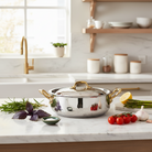 Mauviel M'ELITE B hammered 5-ply rondeau with curved lid, brass handles, 6-quart size, made of high-quality cookware material.