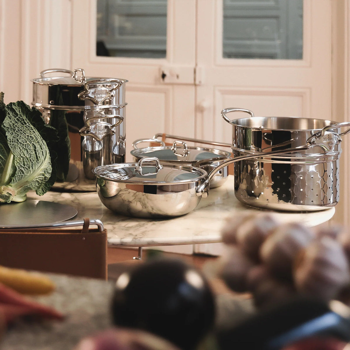 Mauviel stainless steel cookware in a home kitchen